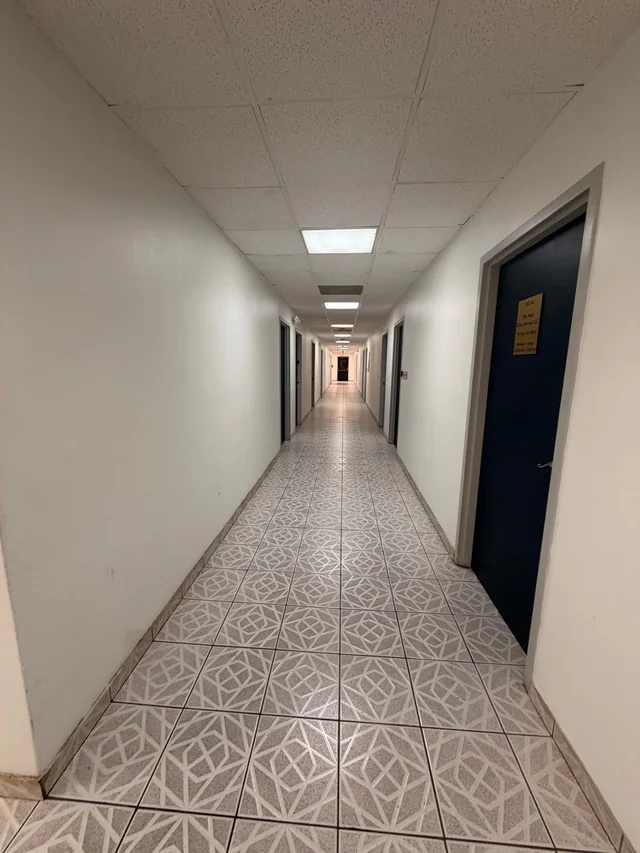 Interior corridor with numbered office doors