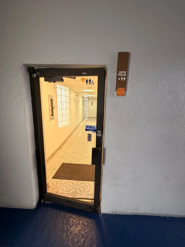 Glass door leading into the suite corridor